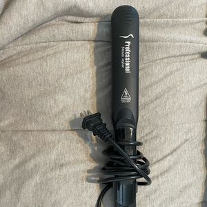 Professional hair straightener/curler. Uses steam to maintain hair Health